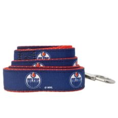 Perfect for walks in Portage la Prairie, Winnipeg, Brandon, Selkirk, and Steinbach, and throughout Manitoba with the Edmonton Oilers All Star NHL Leash 4′. Crafted with double-stitched grosgrain ribbon and featuring a printed team logo on premium American-made webbing, this leash combines durability with style. Complete with top-quality American-made hardware and licensed by the NHL, it's the perfect choice for local fans who want to proudly display their team spirit during every walk.